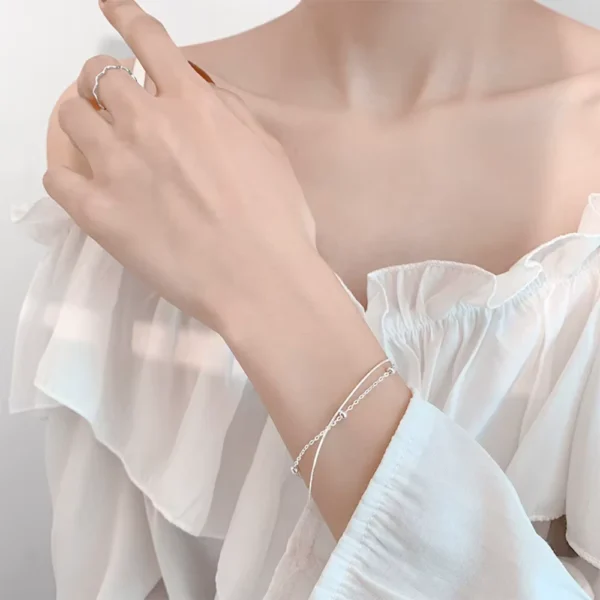 Pulsera Doble Cadena Esferas Aurora Mano